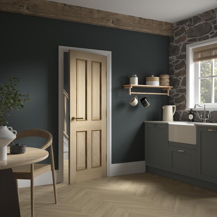 Photograph of a wooden door opening into a dining area